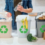 man putting plastic bottle in garbage-bin in kitchen
